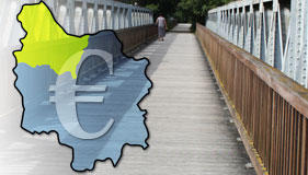 Photomontage représentant le département, une passerelle d'Auxerre et le symbole de l'Euro illustrant la rubrique Prêts et aides au logement.
